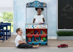 Delta Children Reversible 4-in-1 Pretend Play Center With Chalkboard & Storage What's New